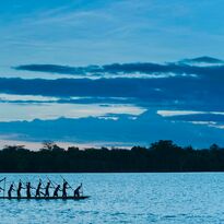 Locals on a canoe, Papua New Guinea.