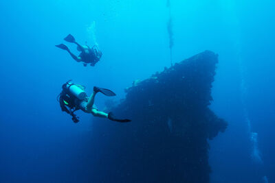 Divers near an underwater wreck