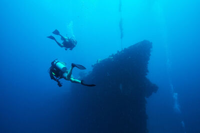 Two divers at a wreck.