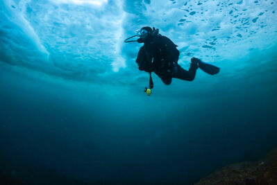 Diver below ice