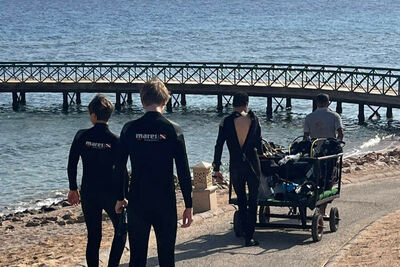 Divers walking to the sea