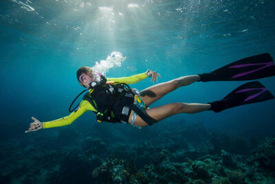 Woman scuba diver in the Maldives