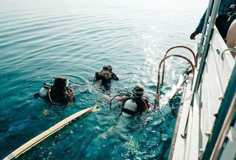 Three women learning to dive