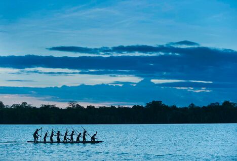 Locals on a canoe, Papua New Guinea.