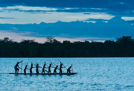Locals on a canoe, Papua New Guinea.