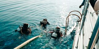 Three women learning to dive
