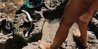 Diver with diving equipment.