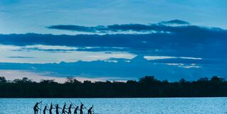 Locals on a canoe, Papua New Guinea.