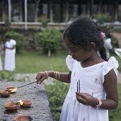 Girl at the Temple of the Sacred Tooth, Sri Lanka.