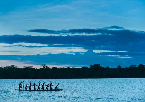 Locals on a canoe, Papua New Guinea.